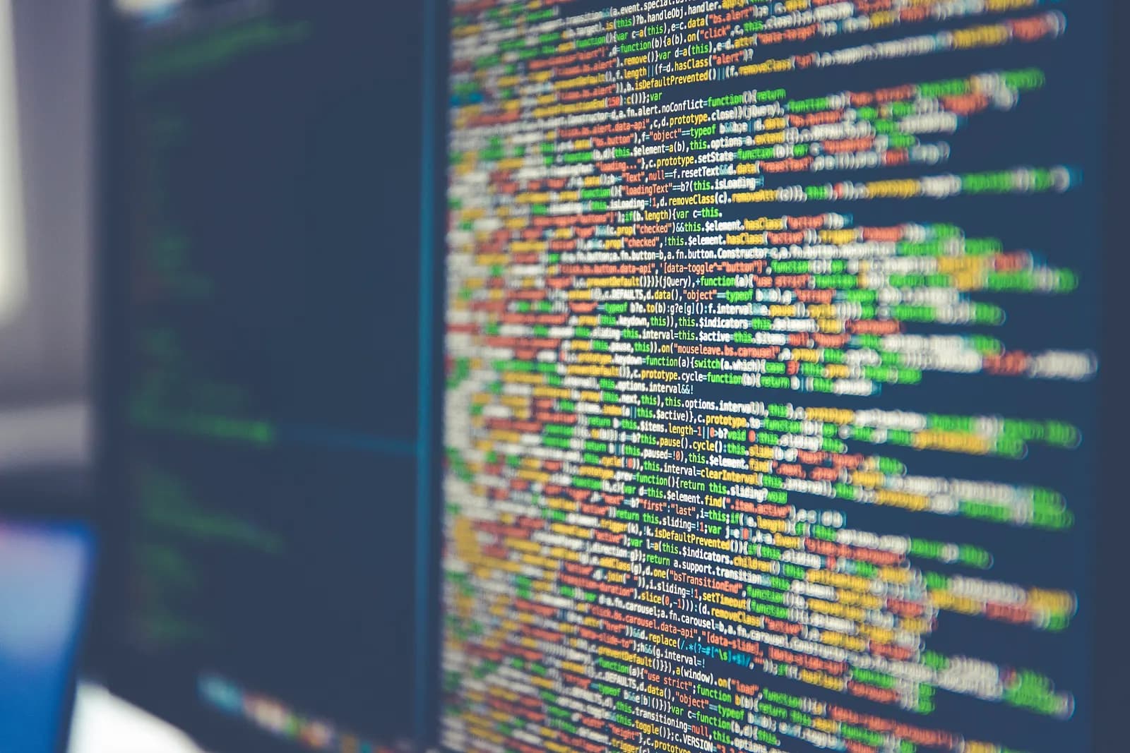 Colorful lines of programming code displayed on a computer monitor